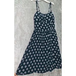 Black & white mini dress with white emblems